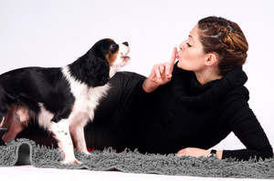 Woman laying next to her dog